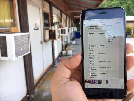 An asylum seeker's phone displays a screenshot, which does not show an interview date as part of his progress for upcoming appointments in the U.S. resettlement assessment process, from inside the Australian-run detention centre on the Pacific island nation of Nauru, February 3, 2017. Handout via REUTERS