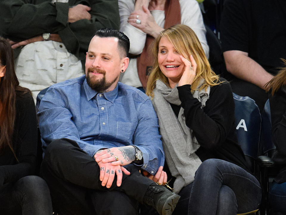 LOS ANGELES, CA – JANUARY 27: Benji Madden (L) and Cameron Diaz attend a basketball game between the Washington Wizards and the Los Angeles Lakers at Staples Center on January 27, 2015 in Los Angeles, California. (Photo by Noel Vasquez/GC Images)