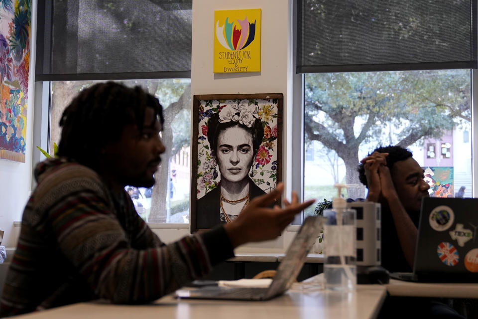 University of Texas at Austin students continue to make use of a space that housed the school's "Multicultural Center" after the name was removed from the wall, Jan. 29, 2024, in Austin, Texas. As Texas public university students returned to the classroom in January, a new law in Texas banning diversity, equity and inclusion initiatives from state funded higher education institutions took effect. (AP Photo/Eric Gay)