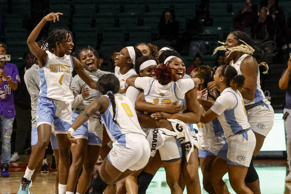 Southern players celebrate after defeating Arkansas-Pine Bluff for the championship after an NCAA college basketball game in the championship of the Southwestern Athletic Conference Tournament, Saturday, March 11, 2023, in Birmingham, Ala. (AP Photo/Butch Dill)