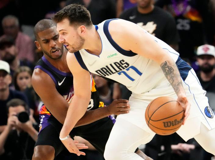 May 15, 2022; Phoenix, Arizona, USA; Phoenix Suns guard Chris Paul (3) pressures Dallas Mavericks guard Luka Doncic (77) during game seven of the second round for the 2022 NBA playoffs at Footprint Center.