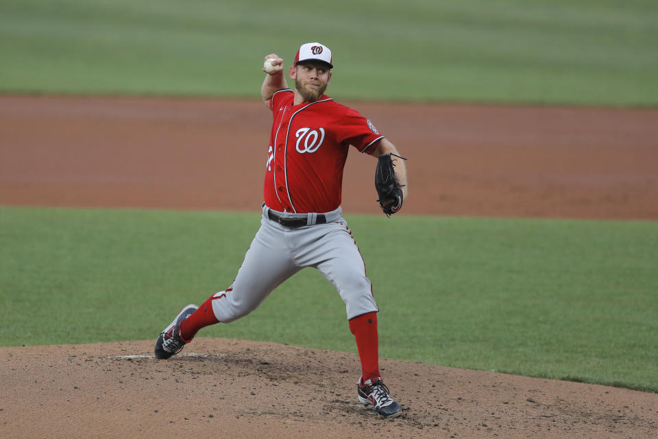 FILE - In this July 20, 2020 file photo, Washington Nationals starting pitcher Stephen Strasburg delivers a pitch to the Baltimore Orioles during an exhibition baseball game in Baltimore. Strasburg has been scratched from what was supposed to be his first start of the season for the Washington Nationals because of a nerve issue with his right hand. Nationals manager Dave Martinez announced the news about four hours before the scheduled first pitch against the visiting New York Yankees on Saturday, July 25. (AP Photo/Julio Cortez, File)