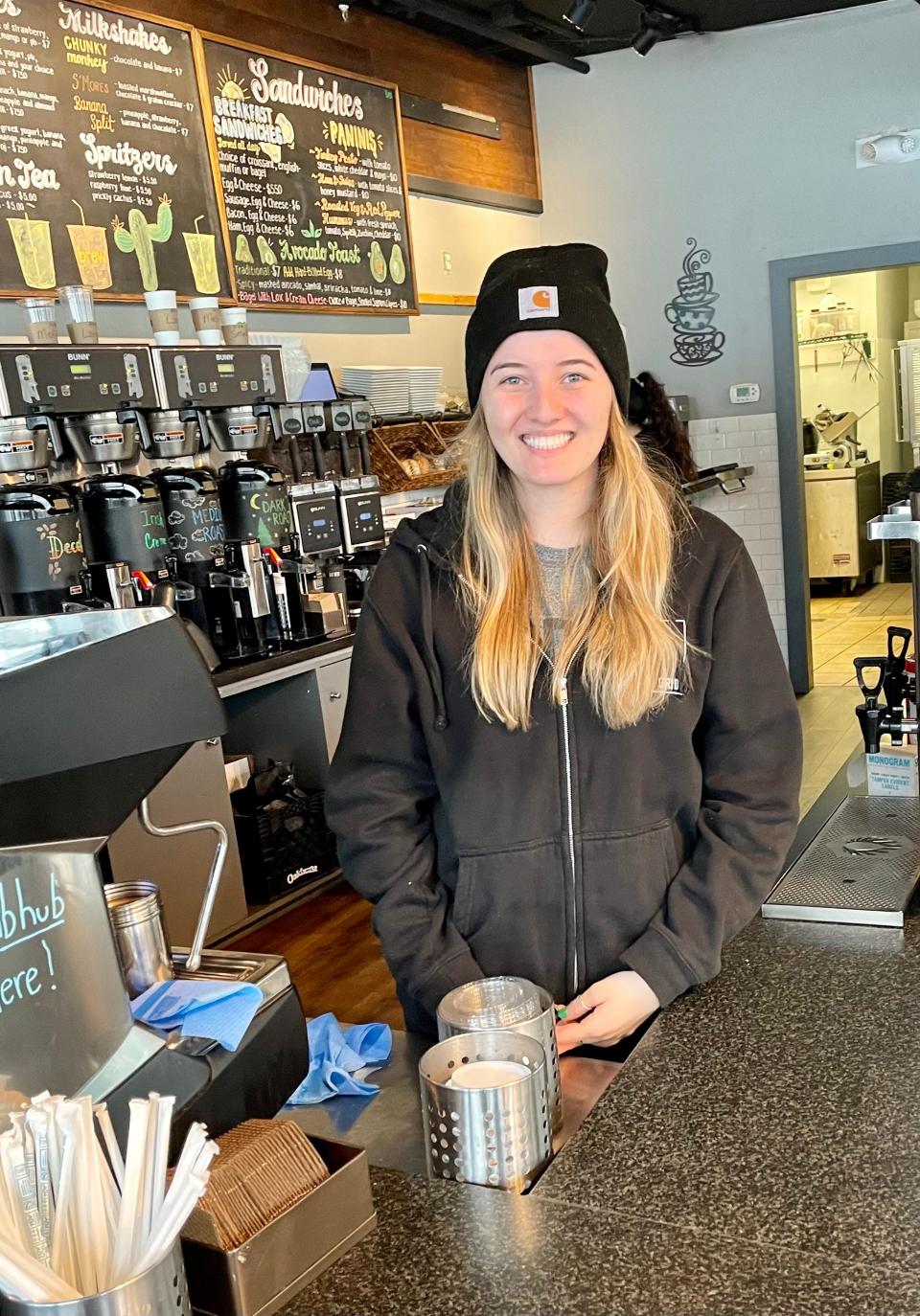 Kaylee Sherburne at Brew on the Grid serving hot drinks to customers who have to brave the weather.