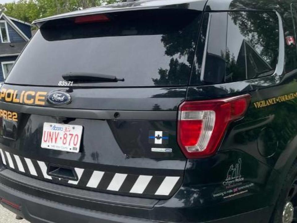 In a photo shared with CBC News, a thin blue line decal is seen on the back of a marked Calgary Police Service cruiser. Chief Mark Neufeld says there are no thin blue line insignias authorized for use on police vehicles.  (Submitted to CBC News - image credit)