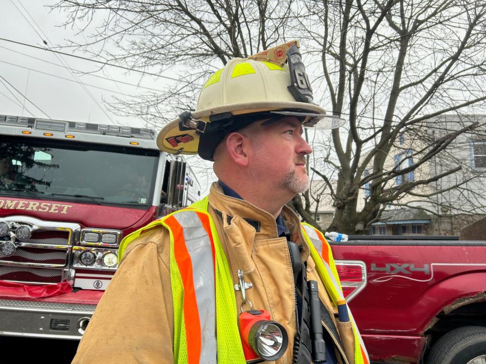 Somerset Volunteer Fire Department 2nd Assistant Chief Bart Close led the team that included firefighters, police and members of the sheriff's office on site of a burning home in Somerset Borough Tuesday.