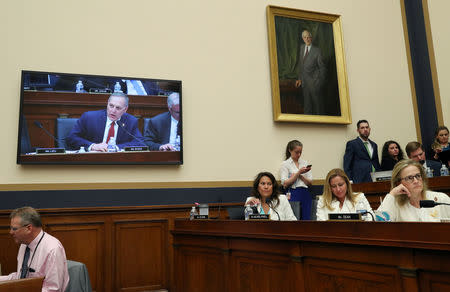 U.S. Reps, from left, Veronica Escobar (D-TX), Debbie Mucarsel-Powell (D-FL) and Madeleine Dean (D-PA) listen to Rep. Andy Biggs (R-AZ) as the House Judiciary Committee considers whether to hold U.S. Attorney General William Barr in contempt of Congress for not responding to a subpoena on Capitol Hill in Washington, U.S., May 8, 2019. REUTERS/Leah Millis