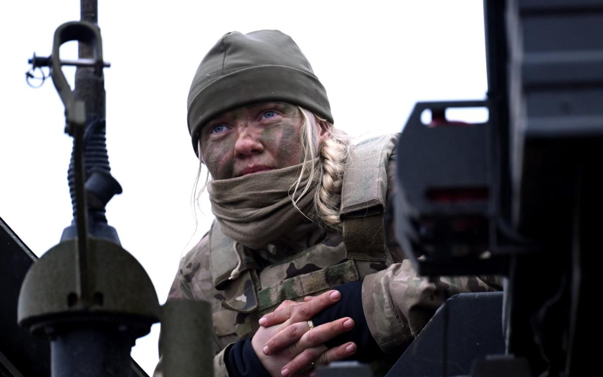 A female soldier takes part in a military exercise in Denmark last year