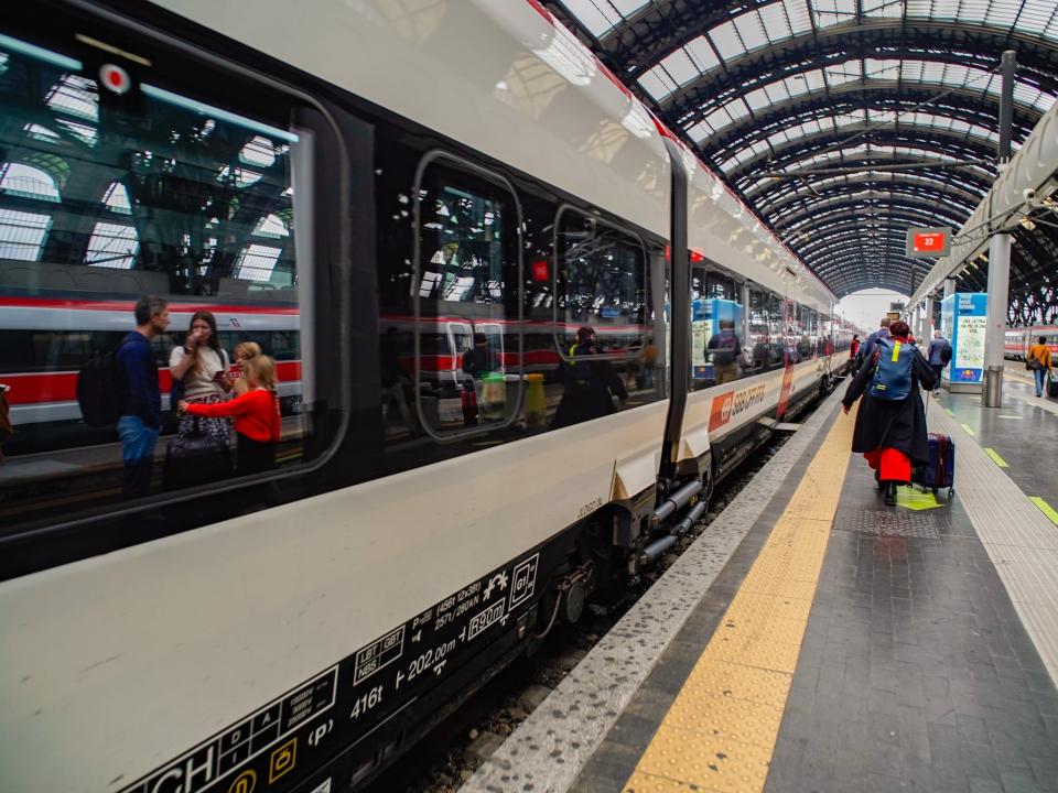 A train stopped at a platform in Milan.