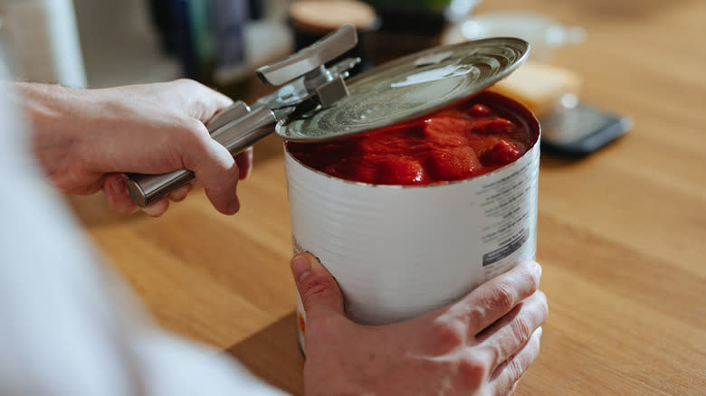 opening a can of tomatoes