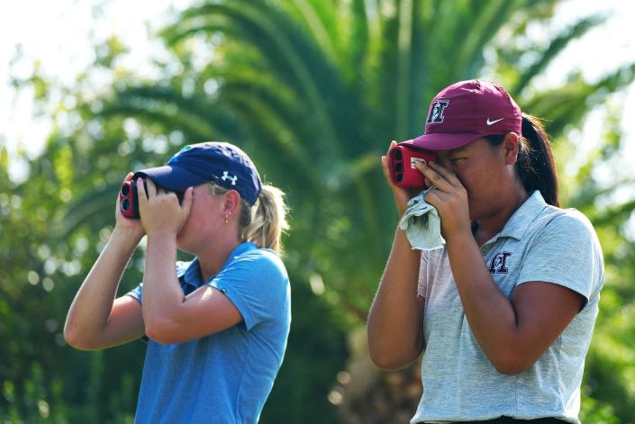 September 7, 2022; Phoenix, Arizona; USA; Hamilton's Jennifer Seo (right) and Xavier Prep's Kate Hauptman look at the green on a par 3 at the Phoenix Country Club Golf Course.
