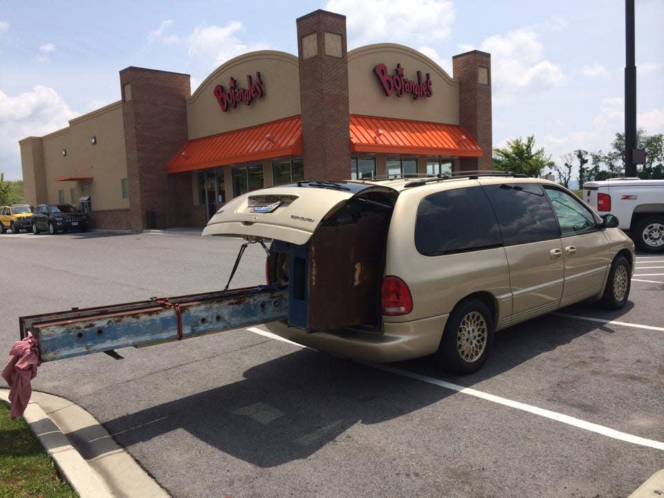 The Bonvechio family's trusty 1998 Chrysler Town & Country LXi, dubbed the Nana Van, is seen in a provided photograph during a trip to Tennessee to rescue a sign that was once used at the well-known Bonvechio's Restaurant in Wainwright. Todd Bonvechio, whose great-uncle once owned the restaurant, found the sign on eBay, but has no idea how it made its way to Tennessee.