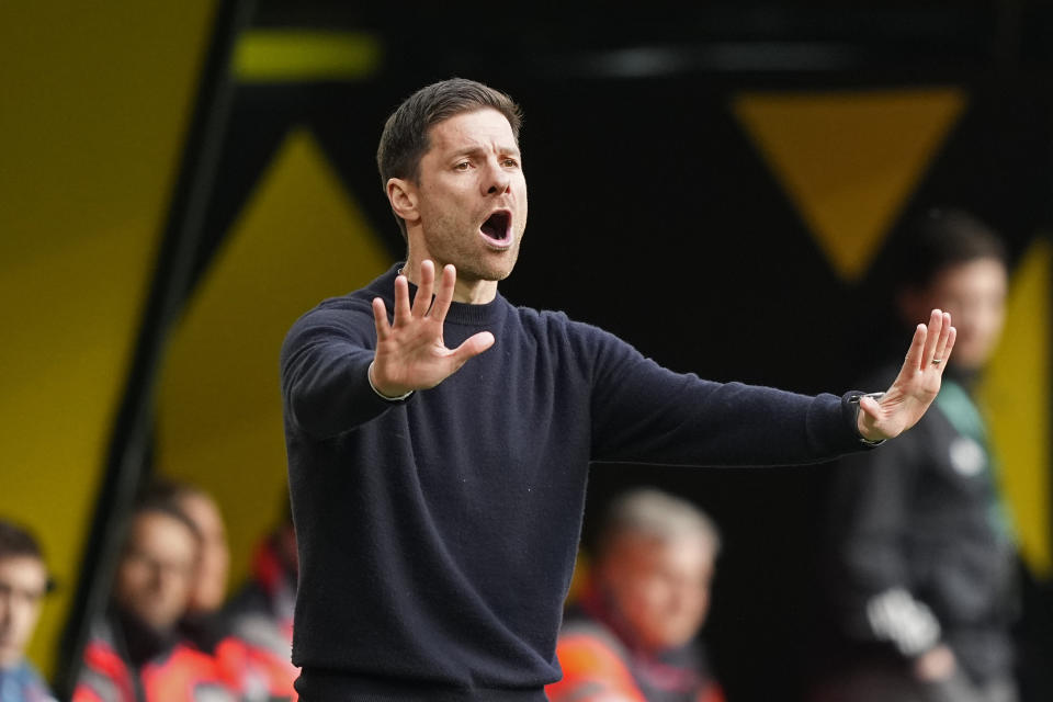 Leverkusen's head coach Xabi Alonso reacts during the German Bundesliga soccer match between Borussia Dortmund and Bayer Leverkusen in Dortmund, Germany, Sunday, April 21, 2024. (AP Photo/Martin Meissner)