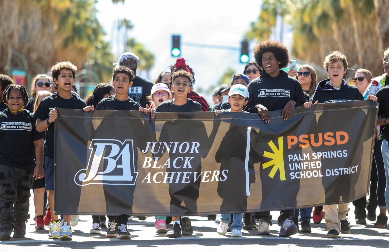 Members of the Junior Black Achievers sing together during the 35th annual Palm Springs Black History parade in downtown Palm Springs, Calif., Saturday, Feb. 26, 2022.