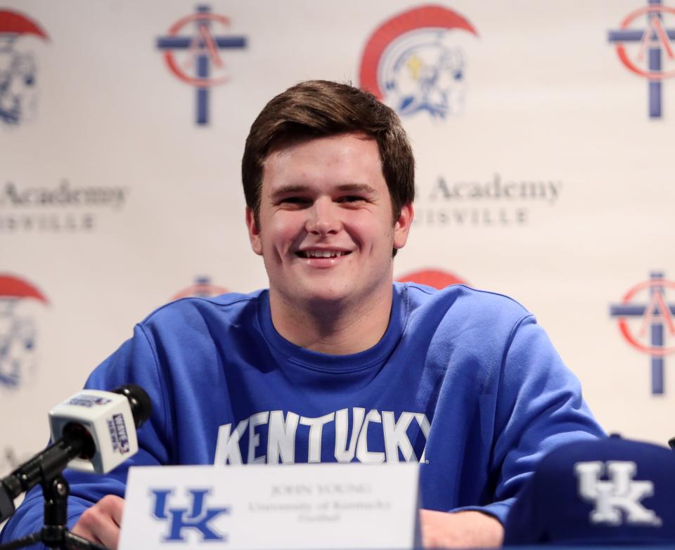 Christian Academy of Louisville's John Young signs with the Kentucky football program on Dec. 18, 2019.