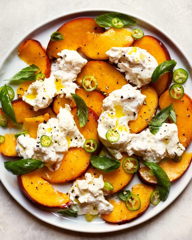 <p>The Daley Plate</p><p>This peach and serrano pepper salad with burrata is the perfect marriage of sweet, juicy, spicy and salty and it’ll be a hit at your next barbecue party.</p><p><strong>Get the recipe: <a href="https://www.thedaleyplate.com/blog/peach-and-serrano-pepper-salad-with-burrata" rel="nofollow noopener" target="_blank" data-ylk="slk:Peach and Serrano Pepper Salad with Burrata;elm:context_link;itc:0;sec:content-canvas" class="link rapid-noclick-resp"><em>Peach and Serrano Pepper Salad with Burrata</em></a></strong></p>