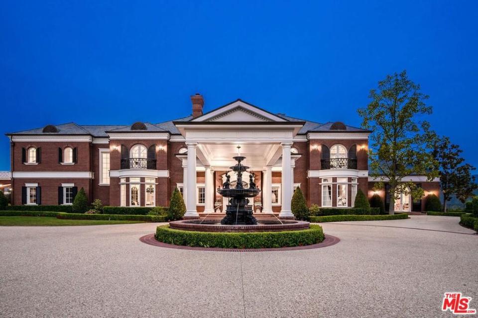 Enter the Colonial Revival through a gated-entry and pull up to the circular motor court.