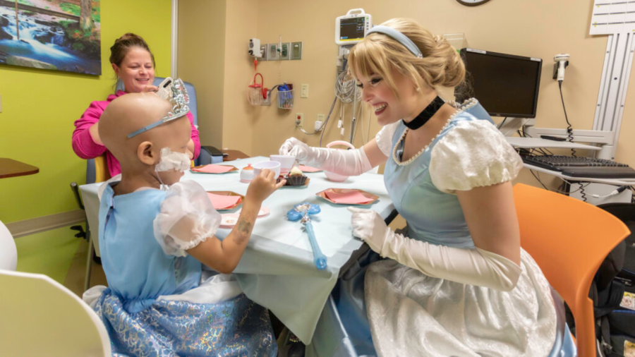 Cinderella enjoys tea with Ivori (pronounced, “Ivory”), age 4, and Ivori’s mom in our pediatric hematology-oncology clinic. (HSHS St. Vincent Children's Hospital)