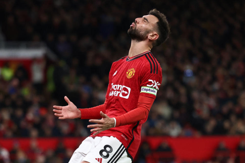 Manchester United's Portuguese midfielder #08 Bruno Fernandes reacts to a missed chance during the English Premier League football match between Manchester United and Tottenham Hotspur at Old Trafford in Manchester, north west England, on January 14, 2024. (Photo by Darren Staples / AFP) / RESTRICTED TO EDITORIAL USE. No use with unauthorized audio, video, data, fixture lists, club/league logos or 'live' services. Online in-match use limited to 120 images. An additional 40 images may be used in extra time. No video emulation. Social media in-match use limited to 120 images. An additional 40 images may be used in extra time. No use in betting publications, games or single club/league/player publications. /  (Photo by DARREN STAPLES/AFP via Getty Images)