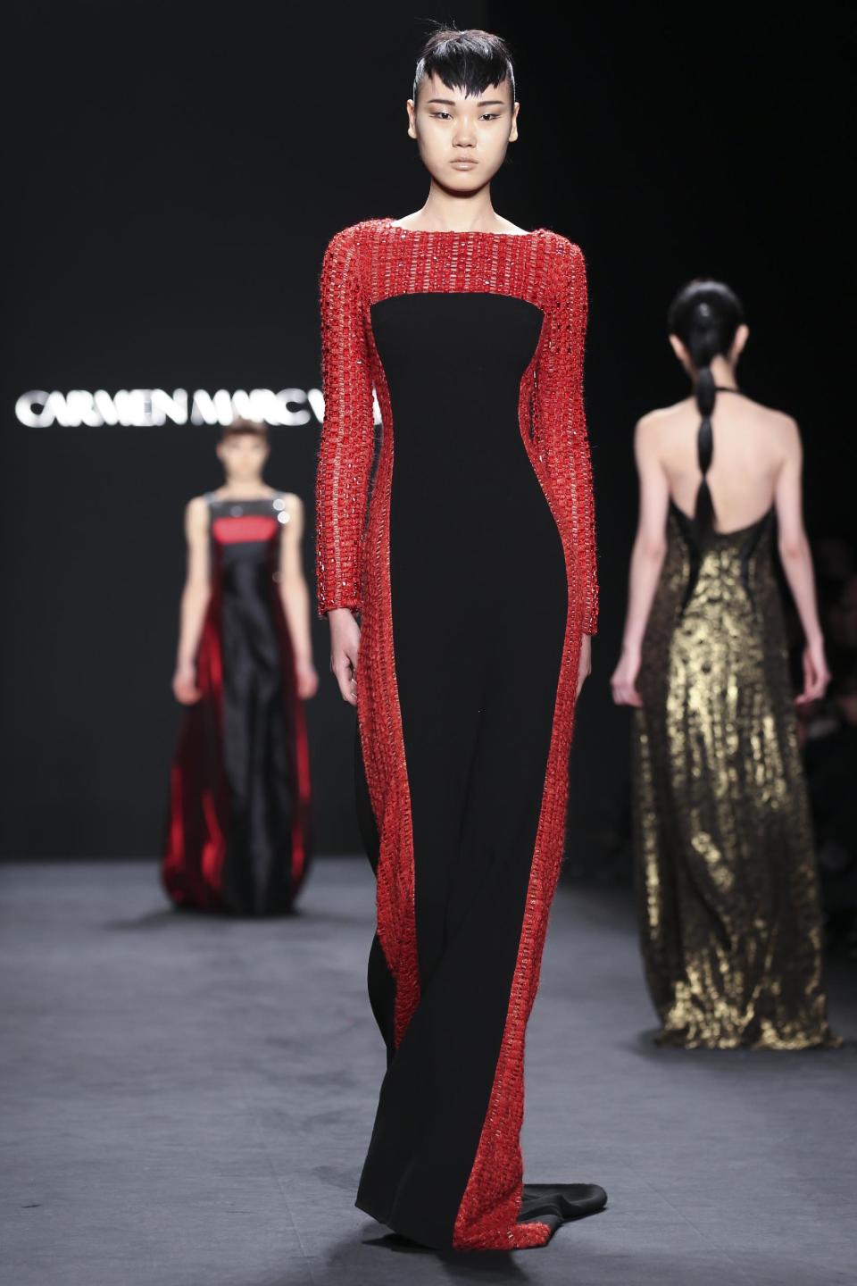 The Carmen Marc Valvo Fall 2014 collection is modeled during Fashion Week, Friday, Feb. 7, 2014, in New York. (AP Photo/John Minchillo)