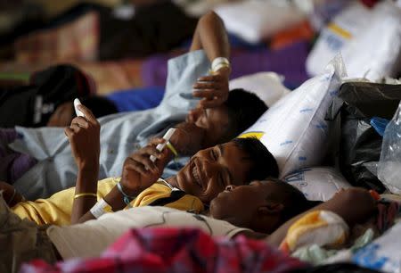 Rohingya migrants who arrived recently by boat rest at a temporary shelter in Kuala Langsa, in Indonesia's Aceh Province May 25, 2015. REUTERS/Darren Whiteside