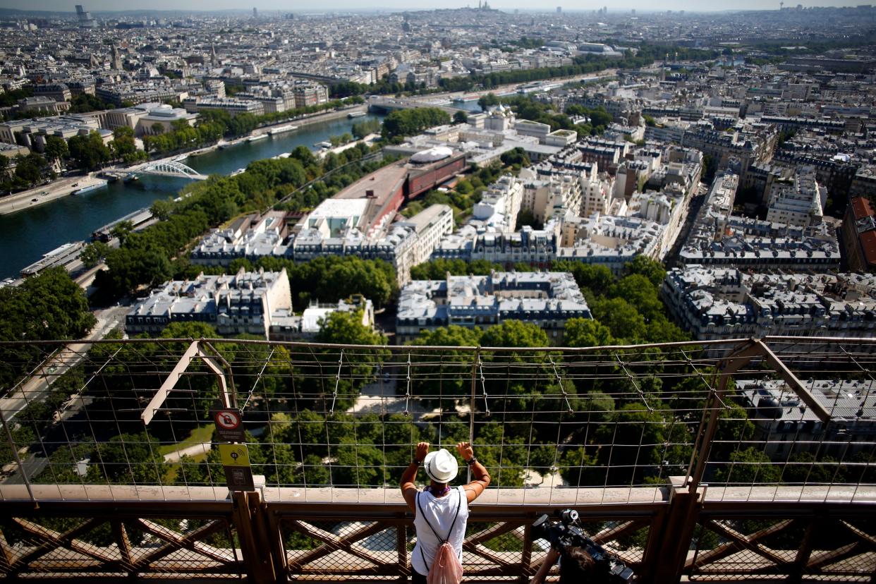 A visitor looks at the view from the Eiffel Tower in Paris on the first day of its reopening on June 25, 2020.