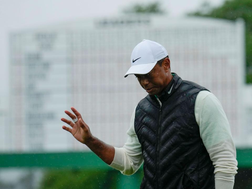 Tiger Woods waves after the second round of the Masters.