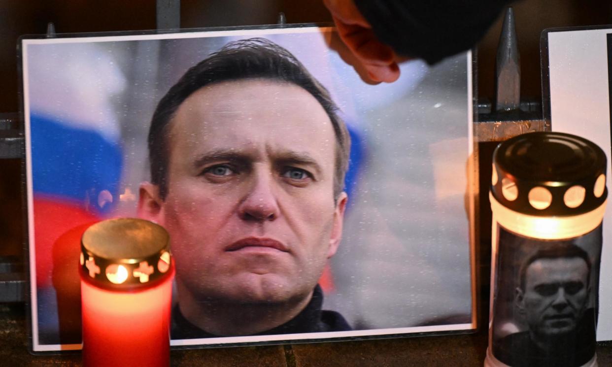 <span>Remembering Alexei Navalny at a makeshift memorial in front of the former Russian consulate in Frankfurt, Germany.</span><span>Photograph: AFP/Getty Images</span>