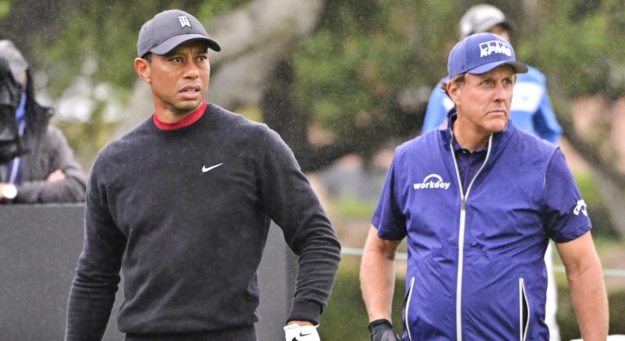 Tiger Woods watches his tee shot on the 10th hole while Phil Mickelson gets ready to hit during the final round of the 2020 Zozo Championship at Sherwood Country Club in Thousand Oaks, California. Photo by John McCoy/PGA Tour via Getty Images