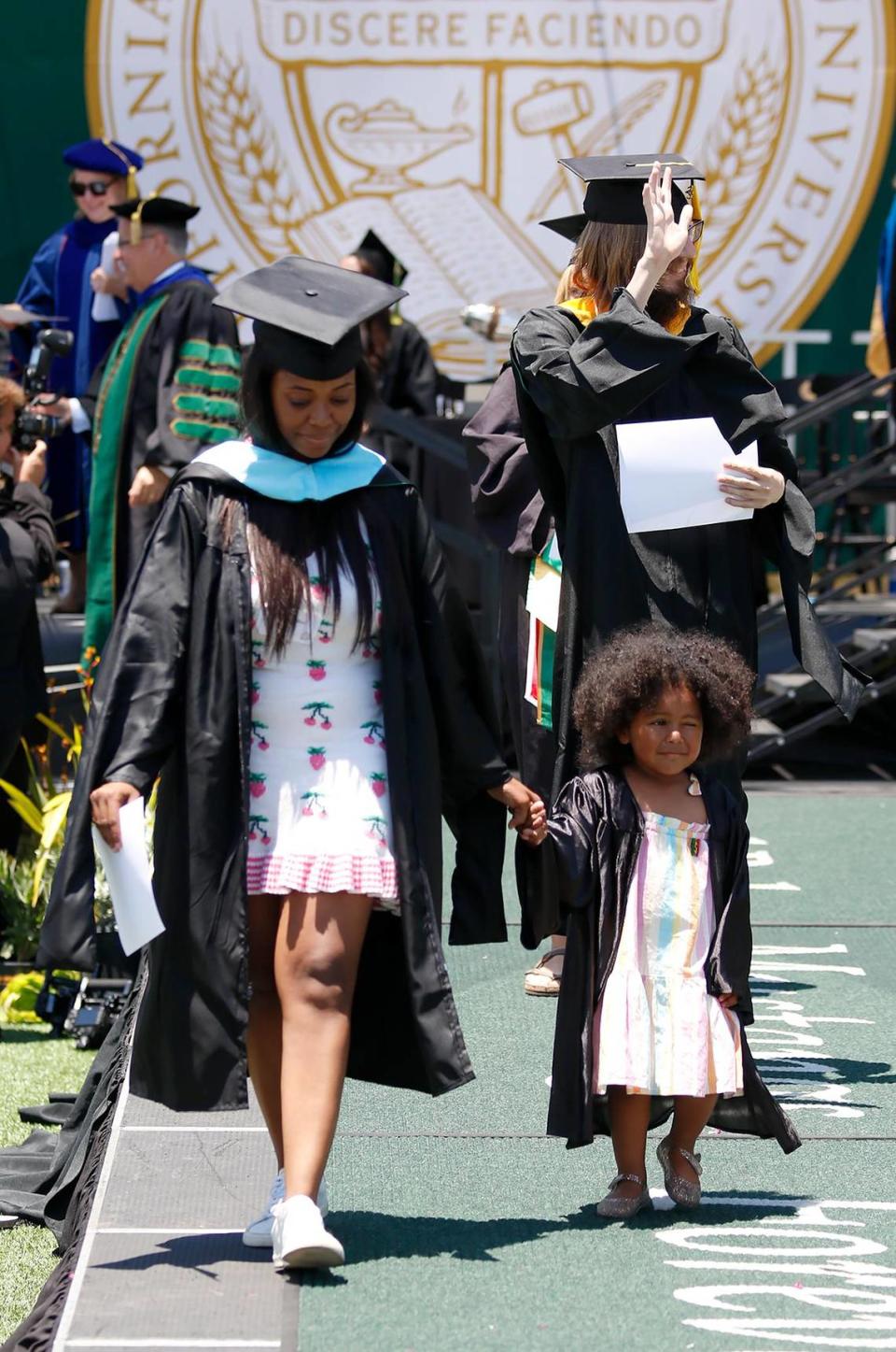 Maya Valeree with daughter Gianna, 2, of San Luis Obispo, who “graduated” with her mom Saturday. Cal Poly celebrated more than 5,000 graduating students in six ceremonies on June 17 and 18, 2023, at Alex G. Spanos Stadium.