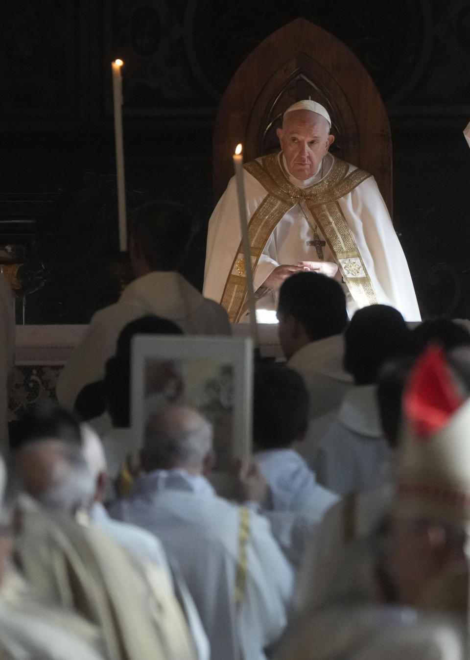 Pope Francis presides over the holy mass in the Cathedral of Asti, northern Italy, Sunday, Nov. 20, 2022, to meet the diocesan community from which his parents had left to emigrate to Argentina and the young people from all over the region on the occasion of the XXXVII World Youth Day. (AP Photo/Gregorio Borgia)