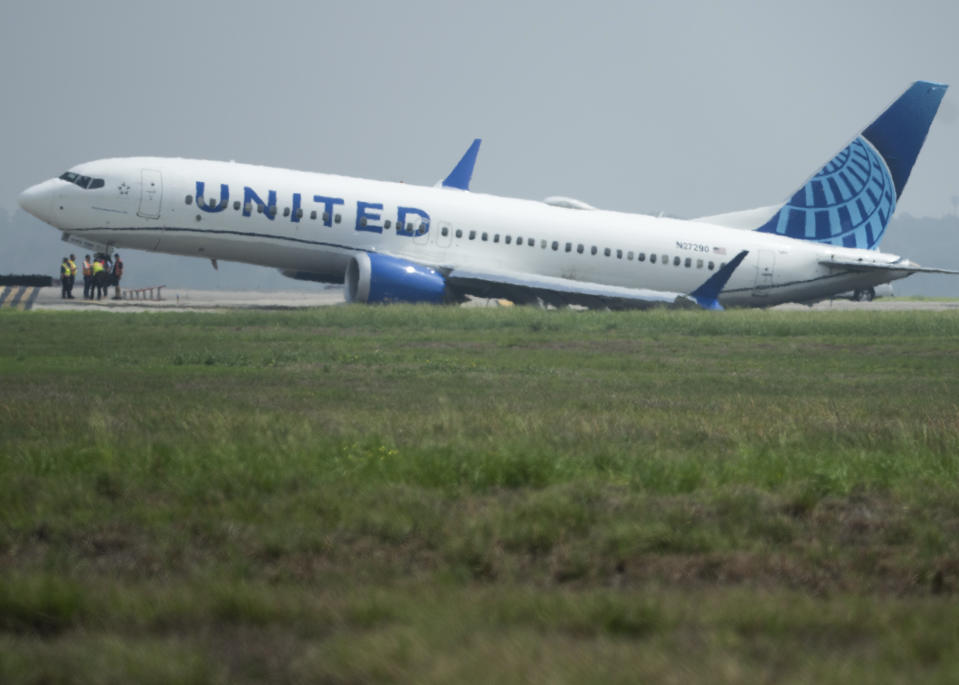 A United Airlines jet sits in a grassy area after leaving the taxiway Friday, March 8, 2024, at George Bush Intercontinental Airport in Houston. No passenger or crew injuries have been reported, according to a United Airlines spokesperson. (Jason Fochtman/Houston Chronicle via AP)