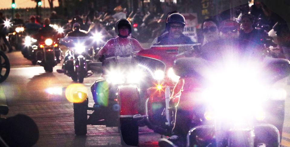 When the sun goes down, the lights come on and motorcyclescruise Main Street on the opening weekend of Bike Week in Daytona Beach.