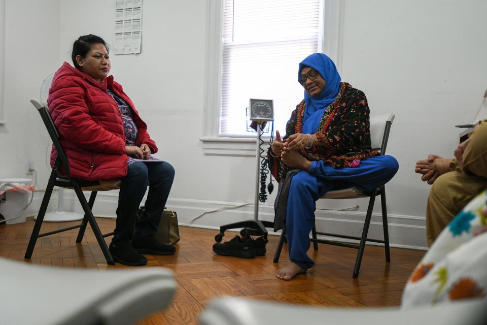 South Asian immigrants often tell Nahar Alam, "I'm alone here." As an immigrant herself, Alam can relate. The community health worker helps her Bangladeshi neighbors get in touch with health care, translation services, housing resources, and mental health care. Seen here, Alam leads a class on March 7 with participant Atiya Khanam, on left.