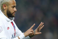 After scoring a penalty against Lille, Paris Saint-Germain star Neymar held up two fingers on his right hand and four fingers on his left to make Bryant's famed No. 24 jersey for the Los Angeles Lakers. (AP Photo/Michel Spingler)