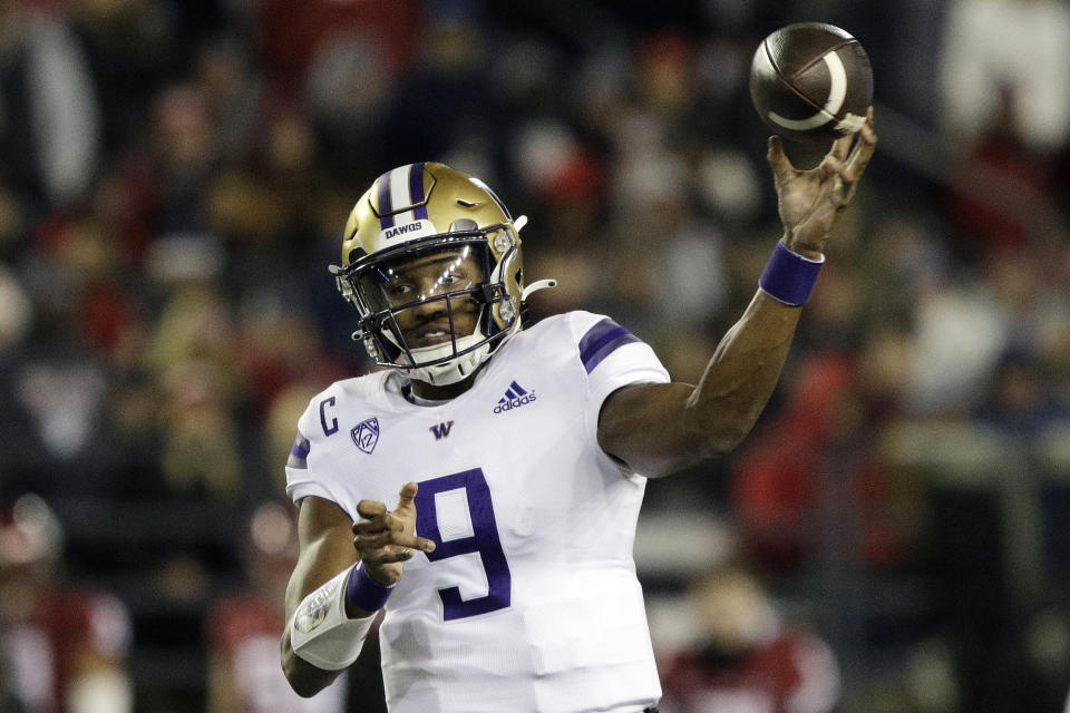 FILE - Washington quarterback Michael Penix Jr. throws a pass during the first half of an NCAA college football game against Washington State, Saturday, Nov. 26, 2022, in Pullman, Wash. Washington faces Souther California on Nov. 4, 2023. This could also have an impact on the Heisman Trophy race with USC quarterback Caleb Williams, last year's winner, and the Huskies Michael Penix Jr. expected to be among the contenders. (AP Photo/Young Kwak, File)