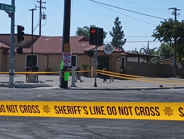 Sheriff&#39;s Office investigators examine the scene of a homicide in south Stockton the morning of May 22, 2023.