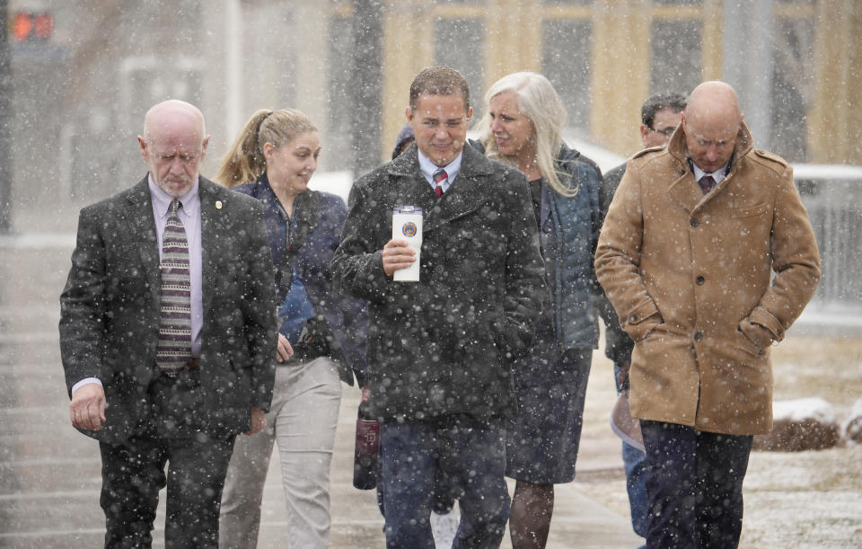 Michael J. Allen, district attorney for Colorado's Fourth Judicial District, front center, leads a contingent of lawyers into the El Paso County courthouse for a preliminary hearing for the alleged shooter in the Club Q mass shooting Wednesday, Feb. 22, 2023, in Colorado Springs, Colo. (AP Photo/David Zalubowski)