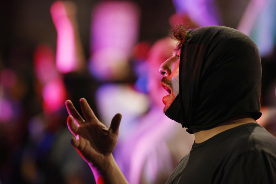 A participant argues with Denver Police officers during a protest outside the State Capitol over the death of George Floyd, a handcuffed black man in police custody in Minneapolis, late Thursday, May 28, 2020, in Denver. (AP Photo/David Zalubowski)