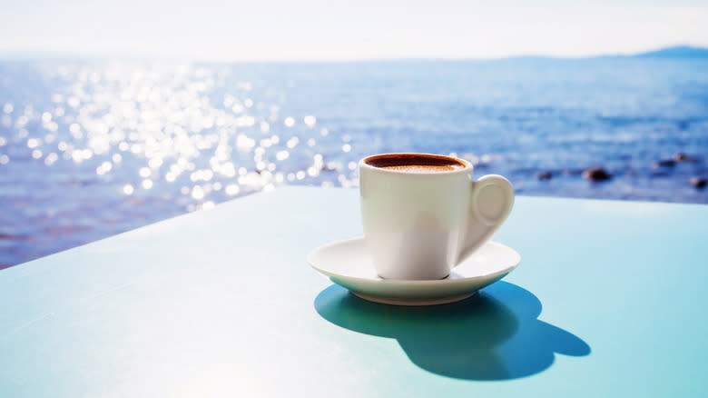 Greek coffee with ocean in background