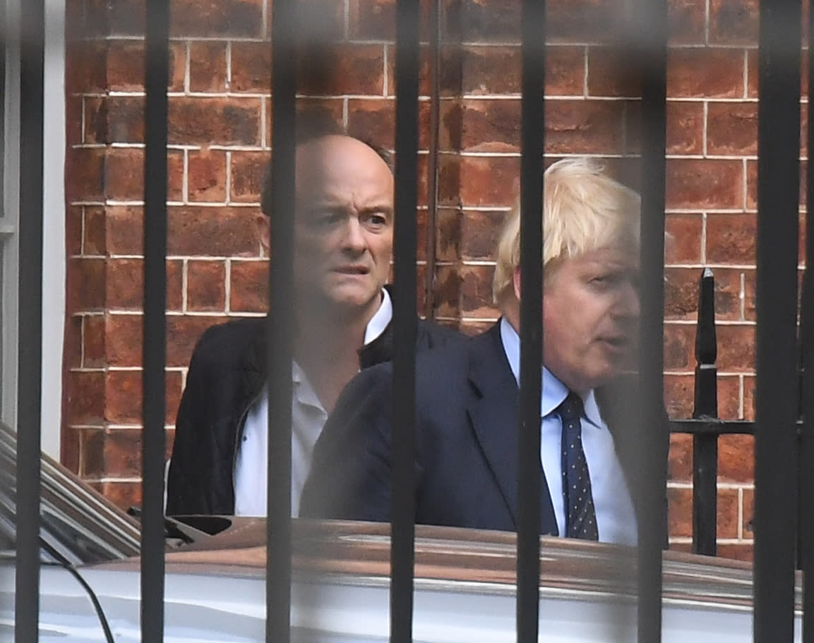 Prime Minister Boris Johnson with his senior aid Dominic Cummings as they leave Downing Street, central London.