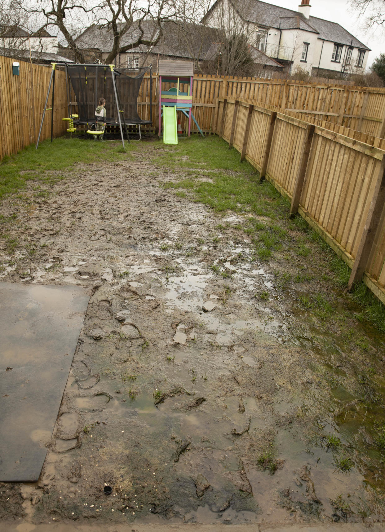 Ellis Reid and her partner Douglas Horn. 
Ellis is living with her partner and her four-year-old son Landon, at a new social housing complex in the village of Dundonald owned by Riverside Housing. 
Since moving in August their garden has become a complete swamp, with algae now growing and the grass flooded. 
When Ellis complained about this she was told by a sub contractor to use a pitch fork and claims they blamed the mess on her four-year-old son and her two dogs.