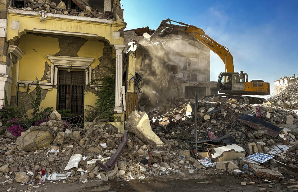 The remains of buildings destroyed during the earthquake are pictured in Antakya, southeastern Turkey Saturday, Aug. 5, 2023. Six months ago today, a devastating 7.8-magnitude earthquake hit the Kahramanmaras and 10 other provinces in southern Turkey on the morning of February 6th. Over 50,000 people died, and hundreds of thousands were left homeless, sheltering in tents and other temporary accommodation. (Halil Kahraman/dia images via AP)