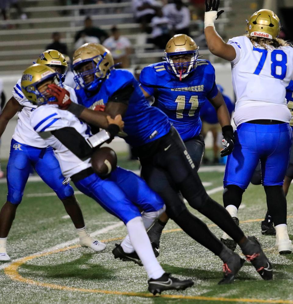 Mainland Dennis King (6) dislodges a pass during Thursday night's game against Osceola.
