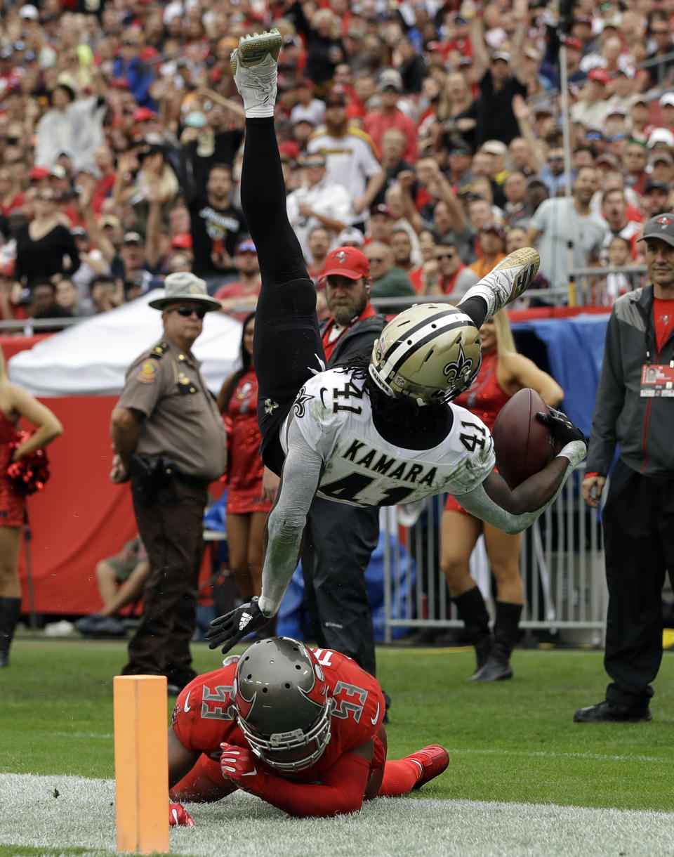 <p>New Orleans Saints running back Alvin Kamara (41) is sent flying on a tackle by Tampa Bay Buccaneers outside linebacker Adarius Taylor (53) during the second half of an NFL football game Sunday, Dec. 9, 2018, in Tampa, Fla. (AP Photo/Mark LoMoglio) </p>