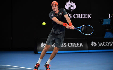 Germany's Jan-Lennard Struff plays a return to Switzerland's Roger Federer during their men's singles second round match on day four of the Australian Open tennis tournament in Melbourne on January 18, 2018 - Credit: AFP