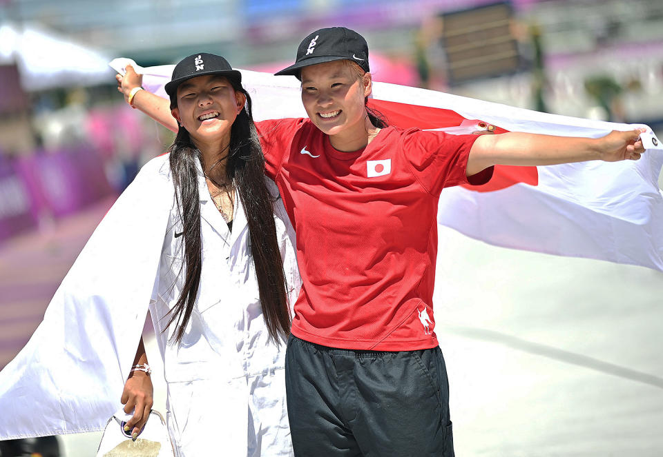 <p>Japan's silver medalist Kokona Hiraki (left) and gold medalist Sakura Yosozumi (right) celebrate their wins during the women's park final at Ariake Sports Park Skateboarding on August 4.</p>