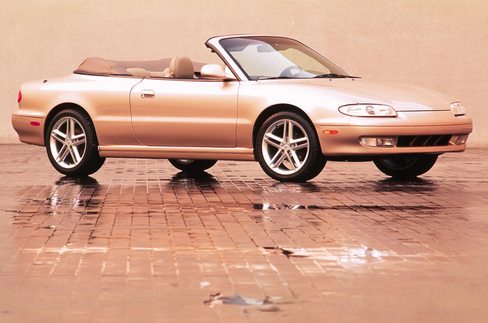 <p>Here's one that we don't know very much about: a drop-top Mazda MX-6 created for the US market in around 1995. We're pretty sure the work was done independently of Mazda by a company such as ASC; we also think that just the one prototype was made for evaluation purposes. If you know more about this one-off that Mazda decided not to put into production just drop us a line.</p>