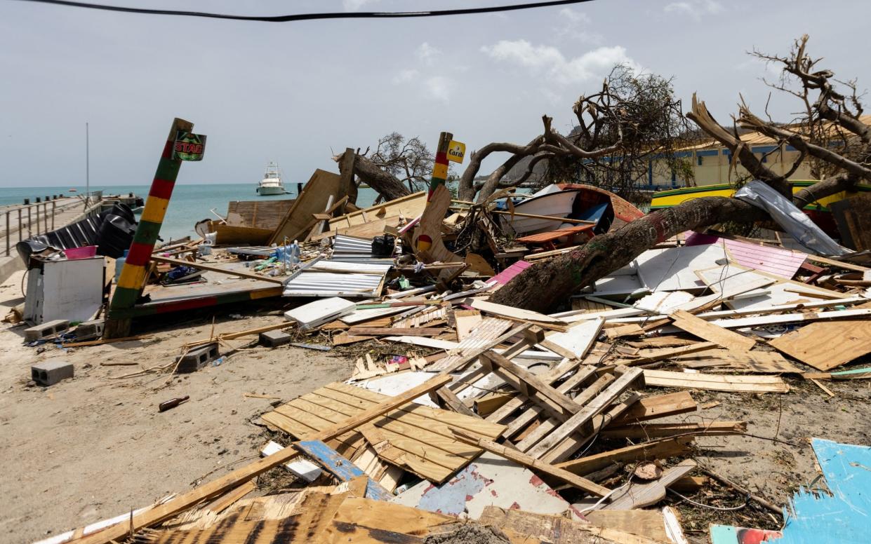 Scattered debris clutters the waterfront on  the island of Carriacou, Grenada