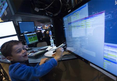 Nicoli Babino works at a post on the floor of the New York Stock Exchange November 29, 2013. REUTERS/Brendan McDermid