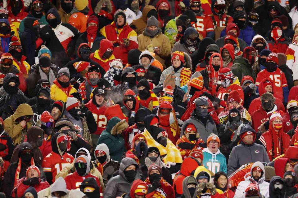 <p>Jamie Squire/Getty</p> Chiefs fans at the Jan. 13 game against the Dolphins